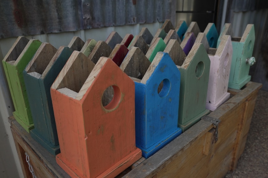 Photo of wooden bird houses.