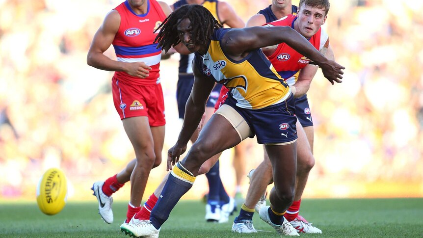 Chasing the pill ... Nic Naitanui contests for a loose ball against the Bulldogs