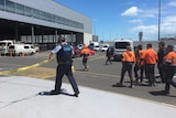 Police clear cordoned off area at Adelaide Airport