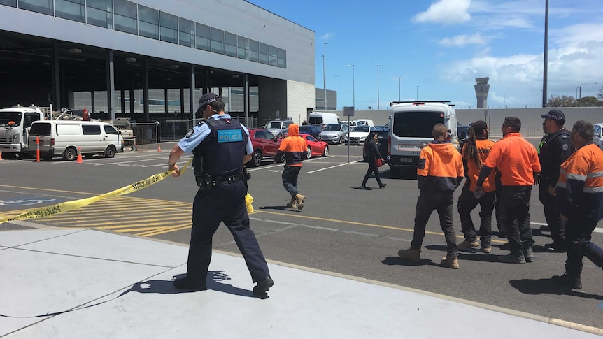 Police clear cordoned off area at Adelaide Airport