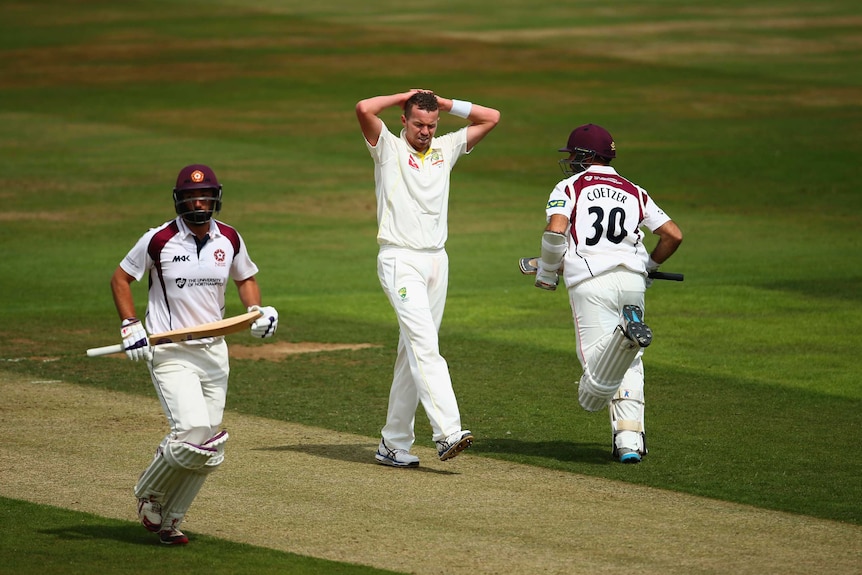 Peter Siddle puts his hands on his head against Northamptonshire