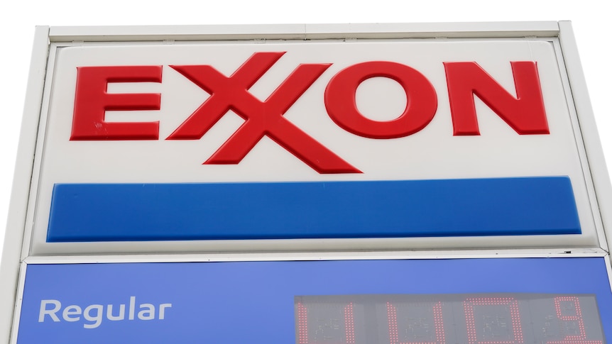 A logo above a petrol sign reading: "Exxon" in red letters.