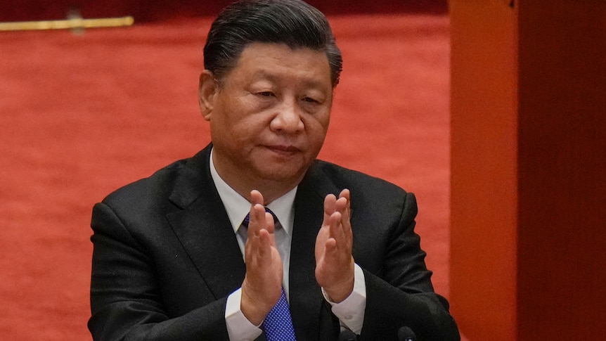 Chinese President Xi Jinping claps during an event