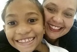 Selfie shows Isaiah (left) and his mother smiling.