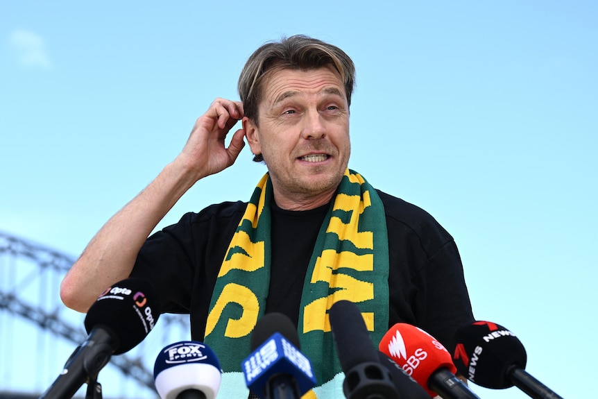 Matildas coach Tony Gustavsson scratches his head while speaking to media at a press conference