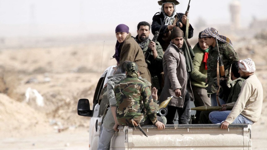 Mercenaries on the back-of a pick-up truck in Libya.