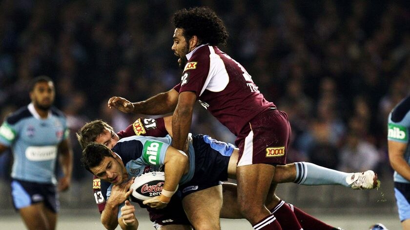 NSW player James McManus is tackled during game one of the State of Origin series