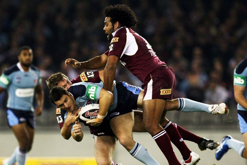 NSW player James McManus is tackled during game one of the State of Origin series