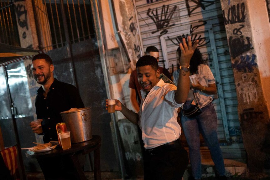A man dances during a street performance in Rio de Janiero