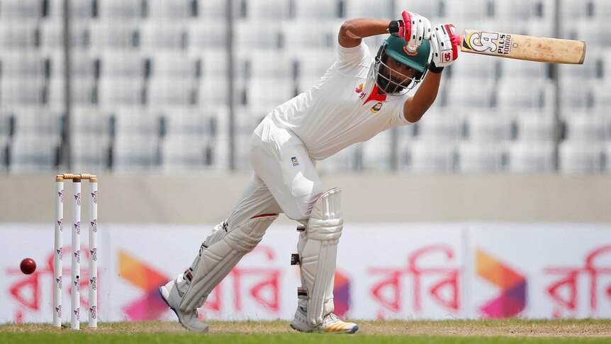 The ball goes past Bangladesh batsman Tamim Iqbal.