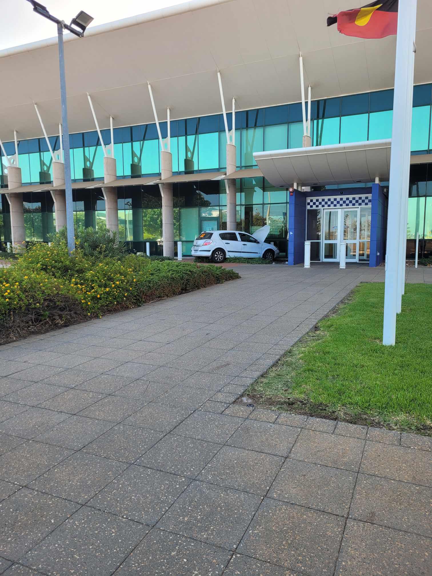 A car crashed into bollards out the front of a building.