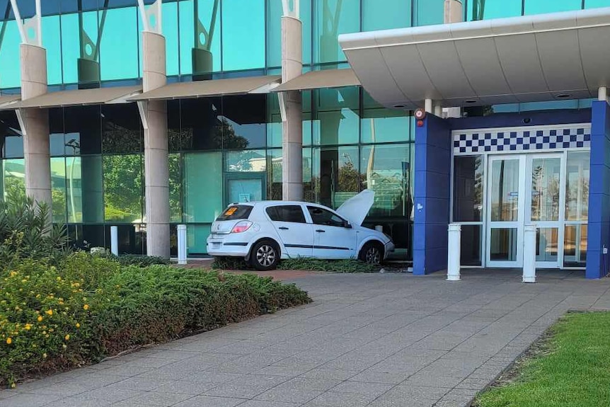 A car crashed into bollards out the front of a building.
