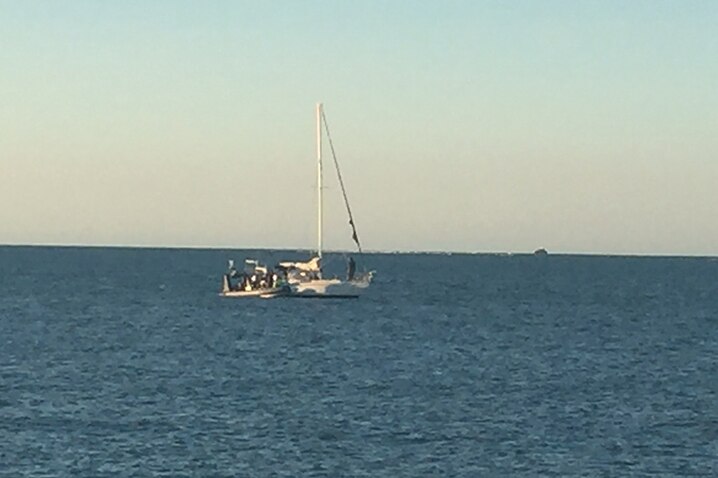 The 73yo sailor's yacht seen from a navy vessel off the NT coast.