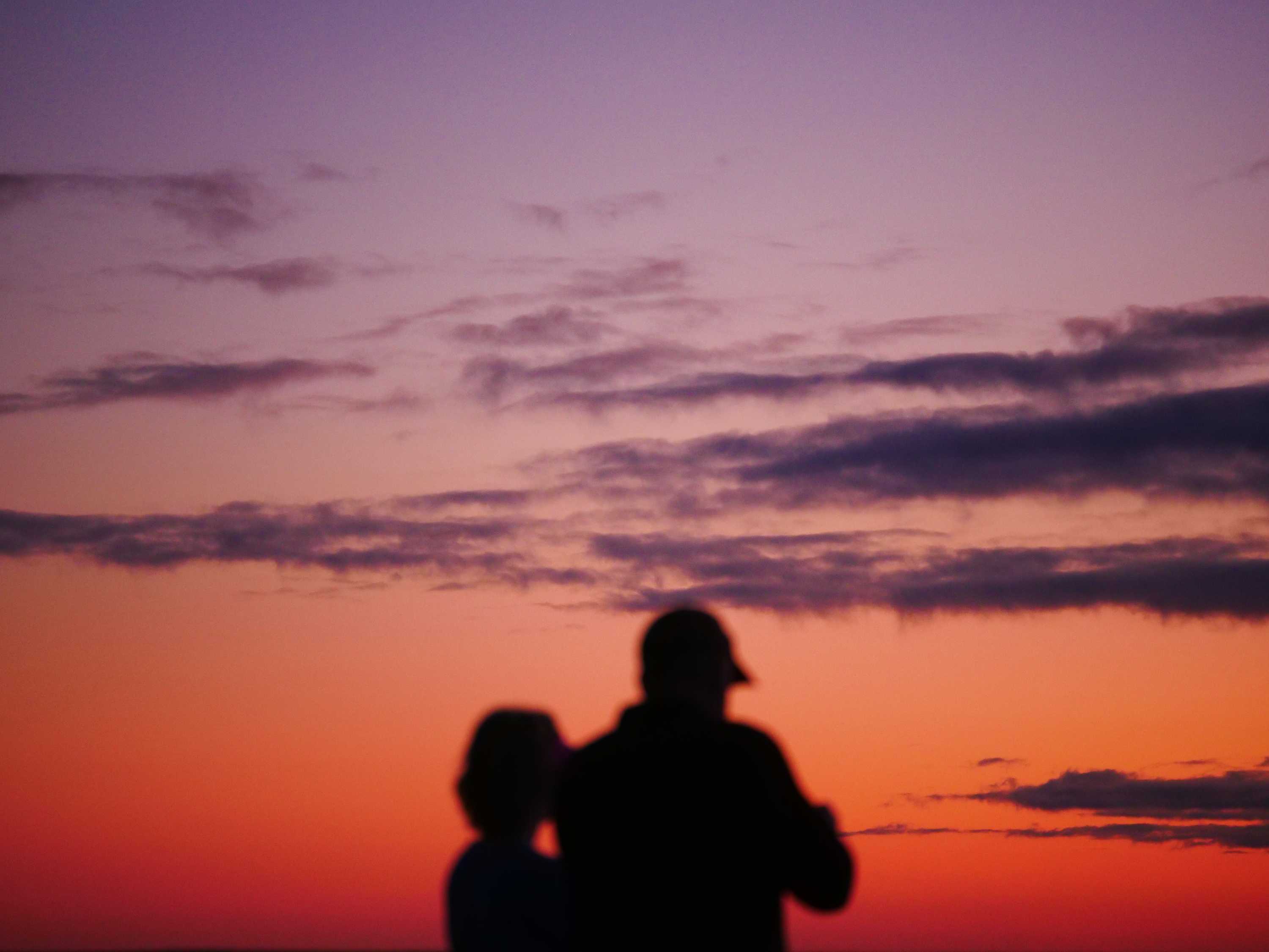 two people at sunrise