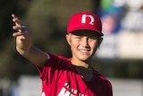 Jordan Strohfeld plays little league baseball throws the ball.