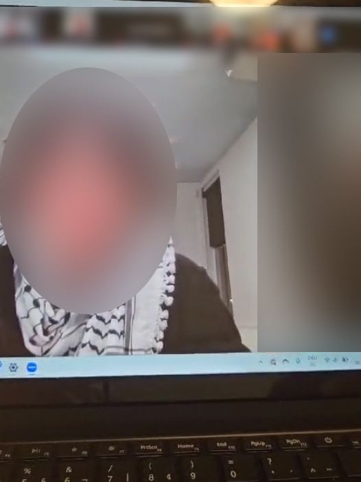A blurred video still from a Zoom call, during which an ANU student allegedly made a Nazi salute.