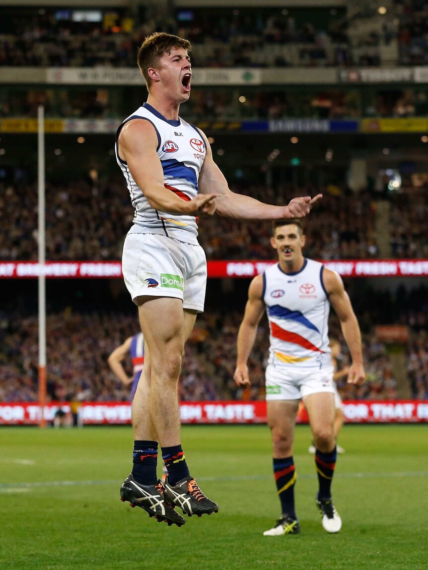 On a high ... Riley Knight celebrates a goal for the Crows against the Bulldogs