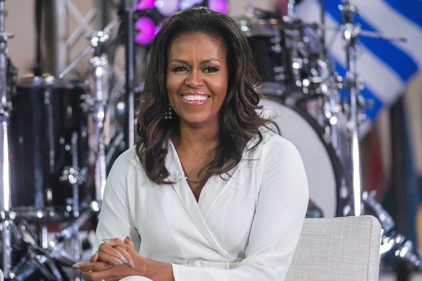 a woman sits on a chair