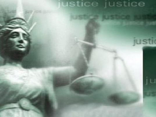 TV graphic of the scales of justice.