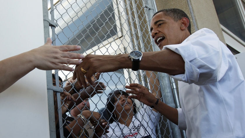 Barack Obama greets factory workers