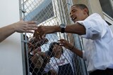 Barack Obama greets factory workers