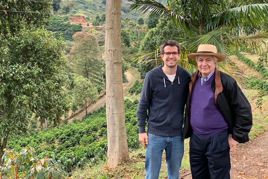 Pedro Echavarría Jnr and Pedro Echavarría Snr of Pergamino Coffee standing in a plantation.