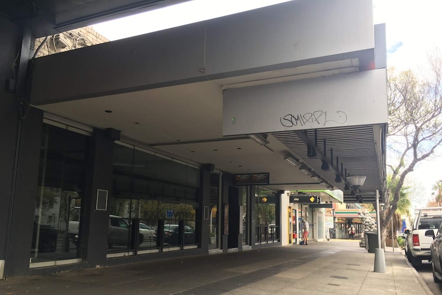 An empty shop front with graffiti on it on Fitzroy Street in St Kilda.