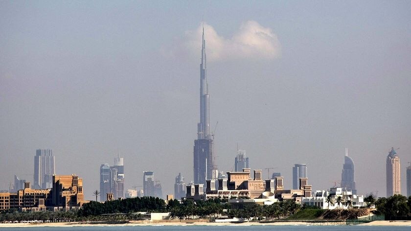 The Burj Dubai, centre, dwarfs the city skyline of Dubai