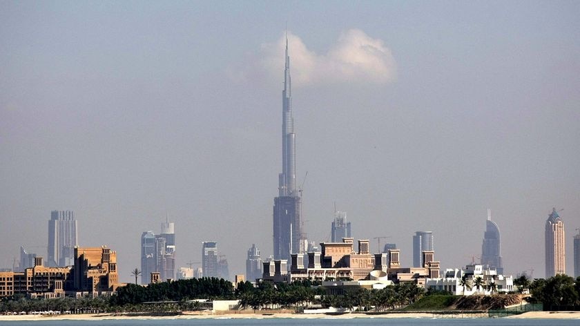 The Burj Dubai, centre, dwarfs the city skyline of Dubai