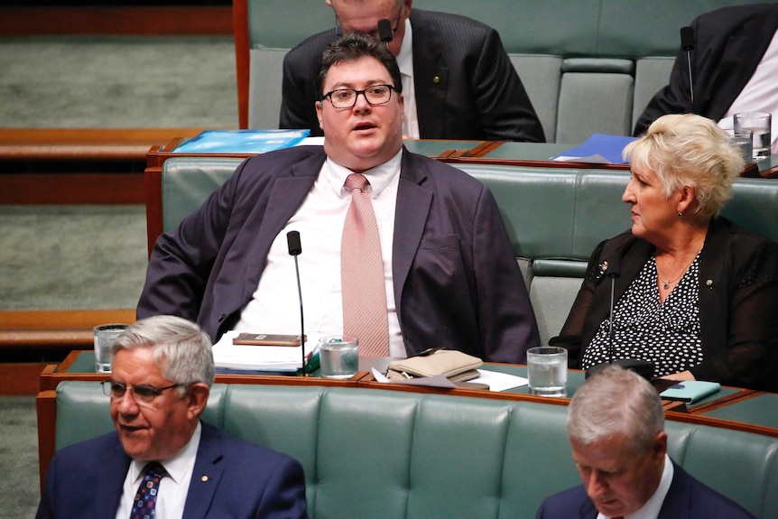 LNP MP George Christensen sits among the backbenchers in Parliament