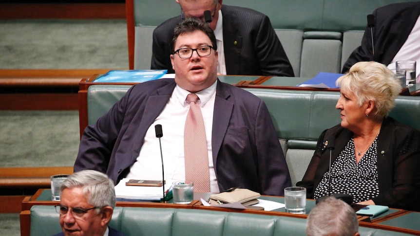 LNP MP George Christensen sits among the backbenchers in Parliament