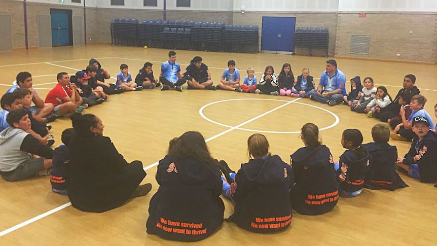 Children sitting in a circle.