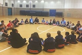 Children sitting in a circle.