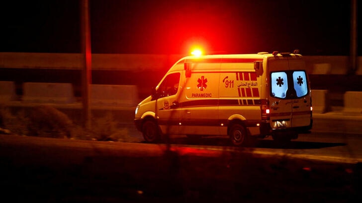 An ambulance heads towards the city of Zarqa on the highway between Jordanian capital of Amman.