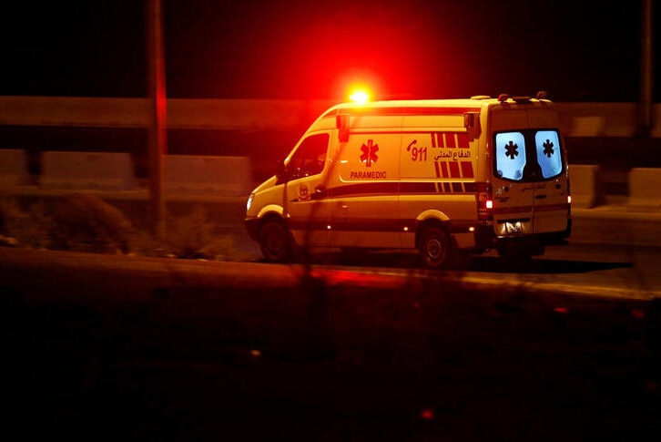 An ambulance heads towards the city of Zarqa on the highway between Jordanian capital of Amman.