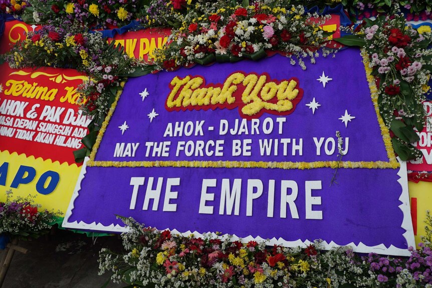 A purple board reads "Ahok Djarot may the force be with you - The empire"