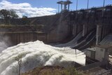 Water being released from a full Wivenhoe Dam in 2015.