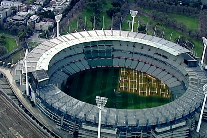 An aerial of the MCG showing an area of darker green seats that is the MCC members area.