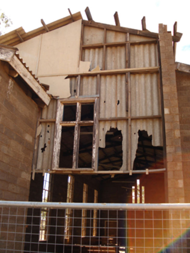 asbestos sheeting on building walls