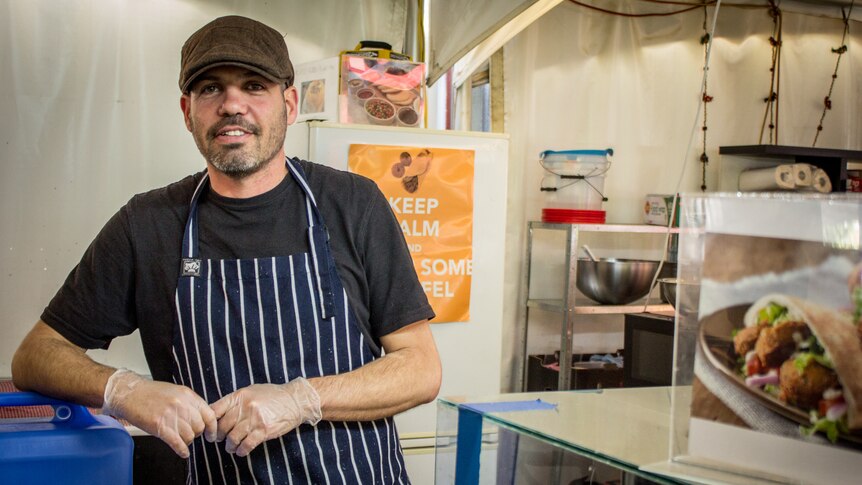 Amir Priffer runs an Israeli food stall at the markets