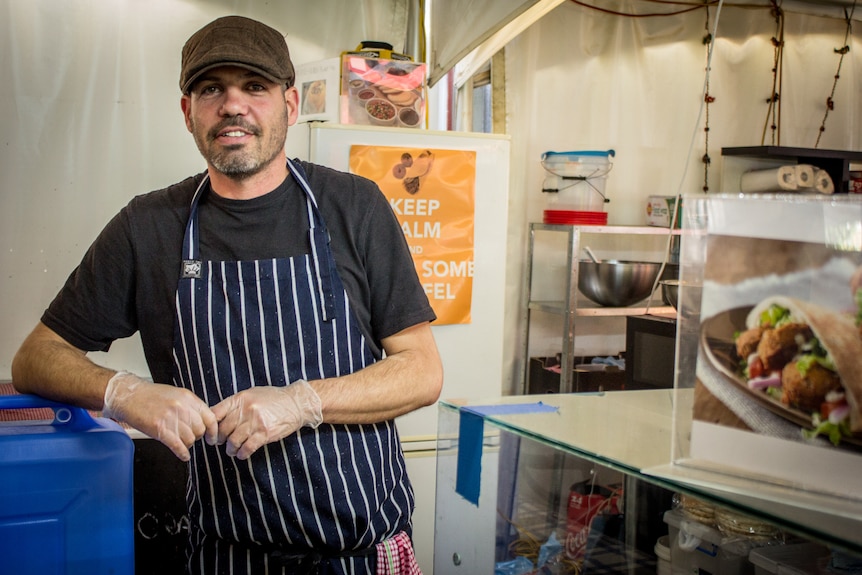 Amir Priffer runs an Israeli food stall at the markets