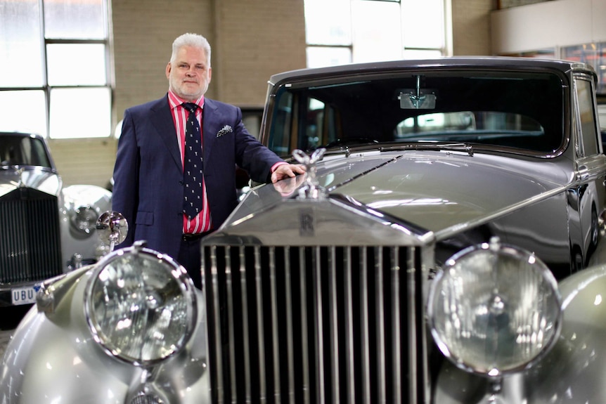 David Eckberg and a vintage Rolls-Royce at his dealership in Sandringham.