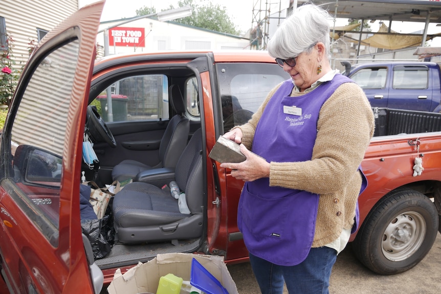 Barb Talbot inspects a box in front of her ute.