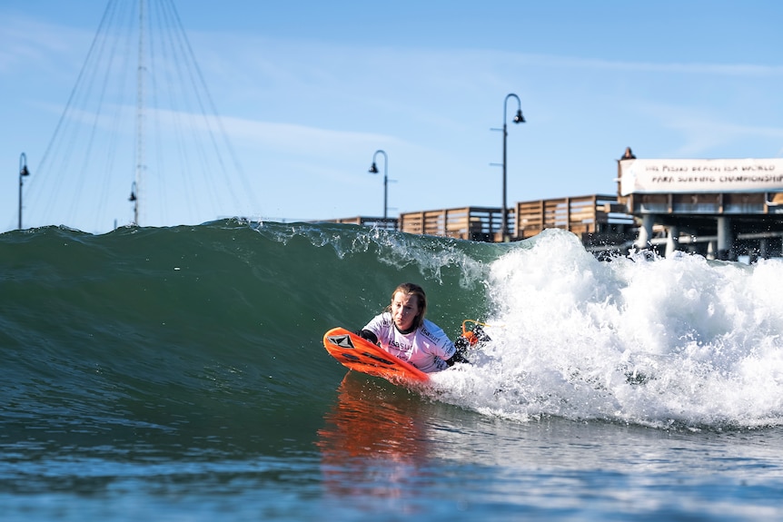 Para surfer Emma Dieters catches a wave