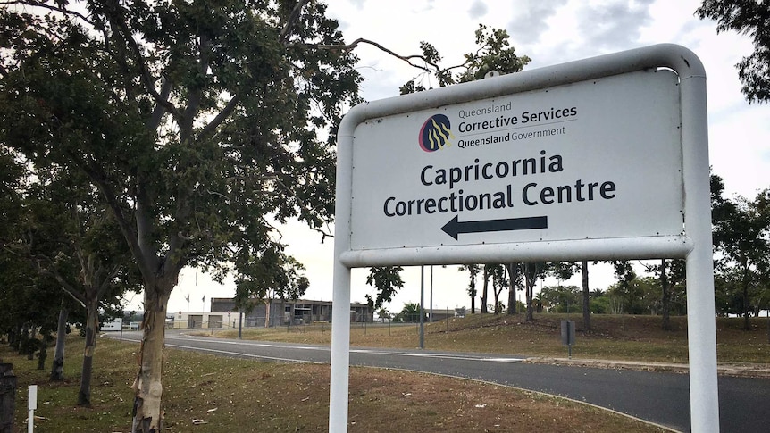 A sign in front of correctional facility 