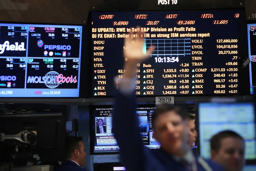 Traders work on the trading floor of the New York Stock Exchange.