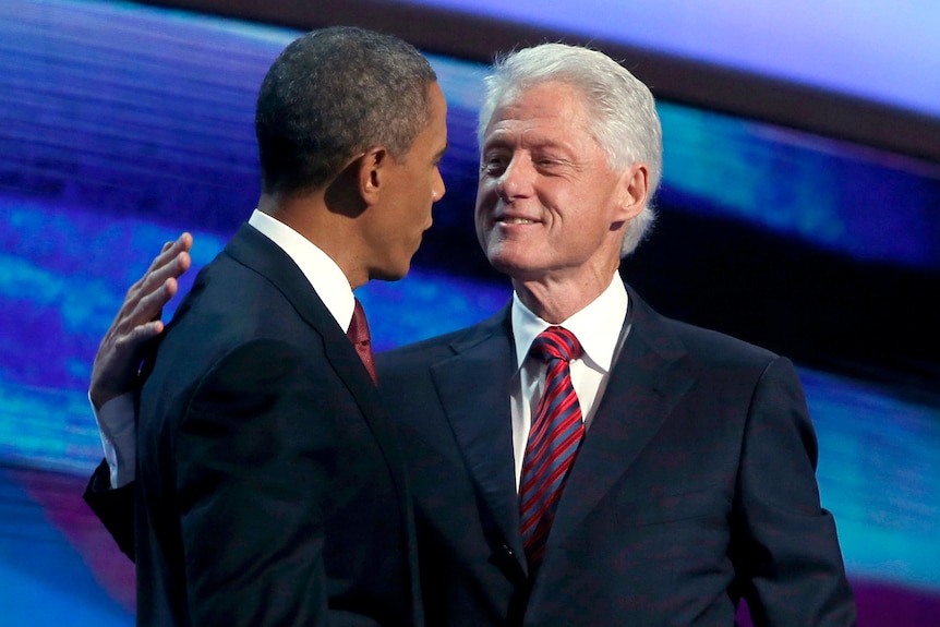 Barack Obama comes on stage to thank Bill Clinton after convention speech