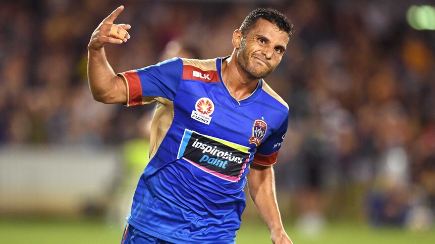 Andrew Nabbout celebrates after scoring for Newcastle Jets against Melbourne City.
