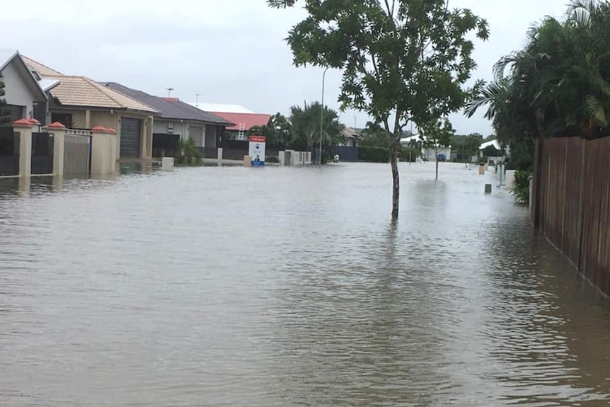 A street in Idalia, Townsville during the monsoonal flooding of February 2019, floodwaters cover the road and reach the houses