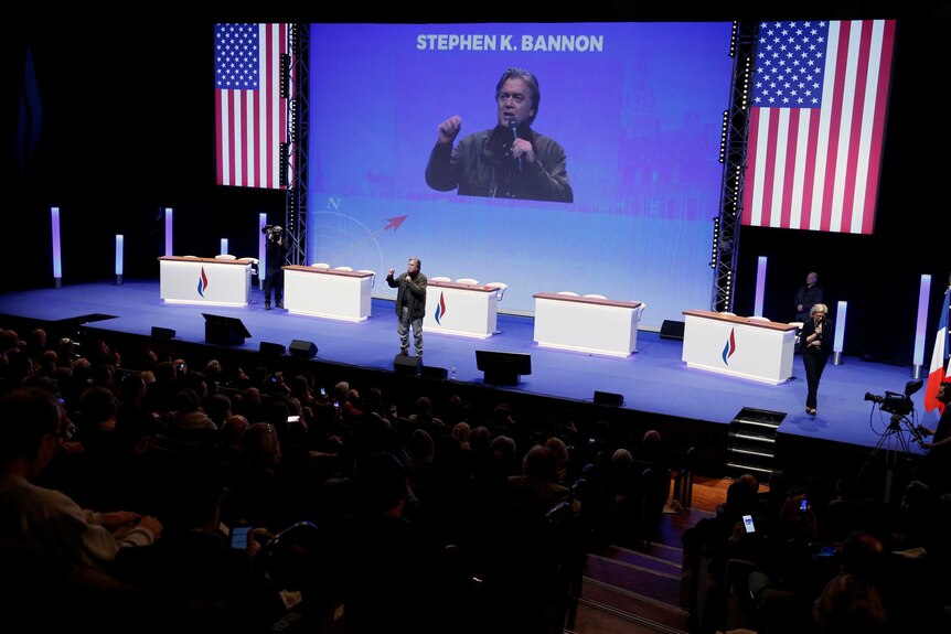 Former White House chief strategist Steve Bannon speaks on stage at a National Front convention.